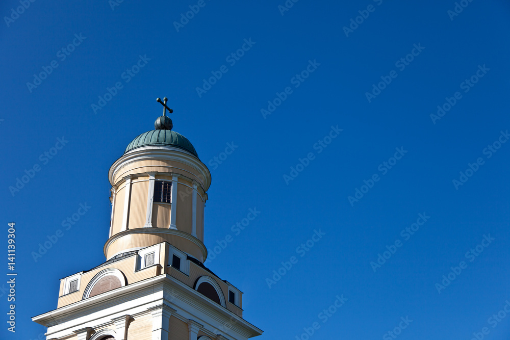 Old yellow chruch and blue sky
