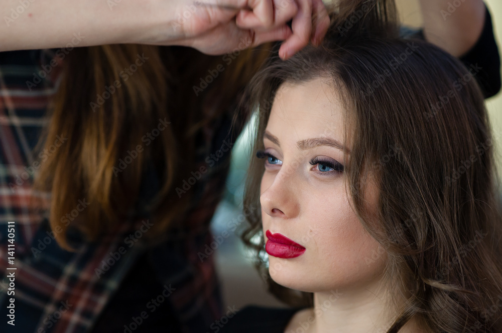 Fototapeta premium Beautiful girl make hairstyle