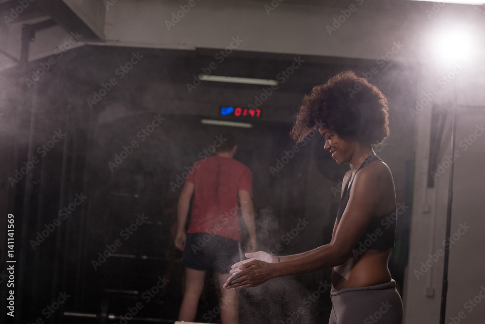 black woman preparing for climbing workout