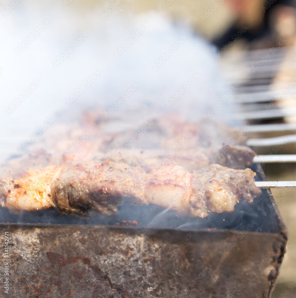 Meat on the grill in the open air Meat on the grill in the open air