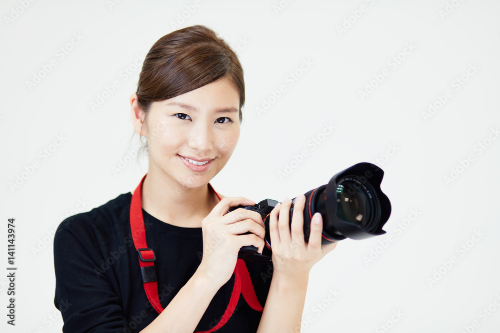 Fototapeta premium カメラを構える女性