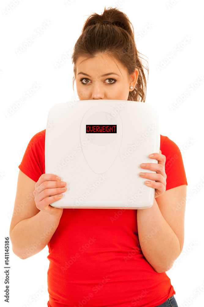 woman holding a scale isolated over white background woman holding a scale isolated over white background