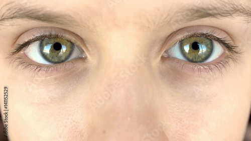 Close-up of young boy's eyes looking at the camera photo