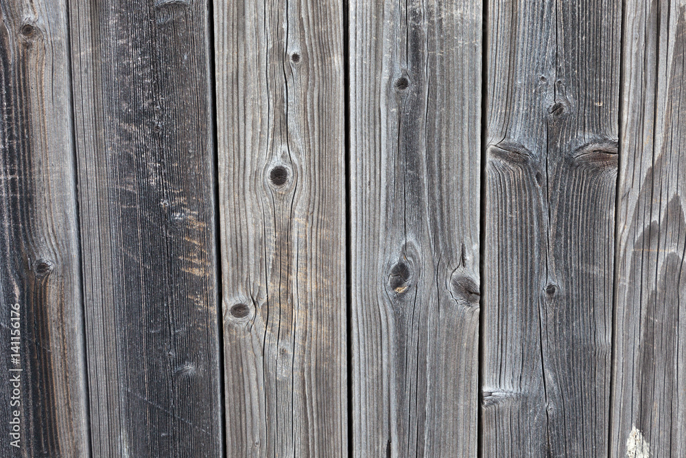 Naklejka premium Vertical worn plank wall