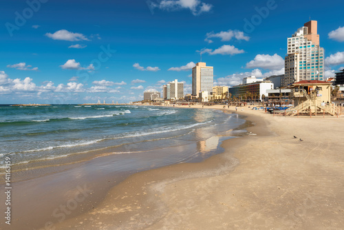 Tel Aviv beach with a view of Mediterranean sea and skyscrapers, Israel. © lucky-photo