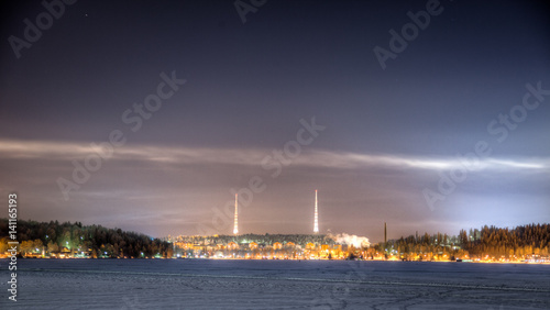 Two radio towers on top of the hill