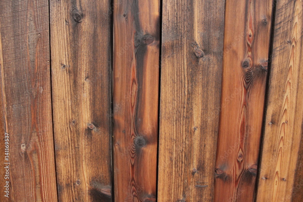 Naklejka premium a wall of wet wooden boards