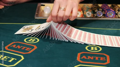Casino: Dealer shuffles the poker cards.
