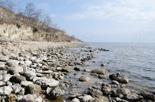 the rocky shore of the lake