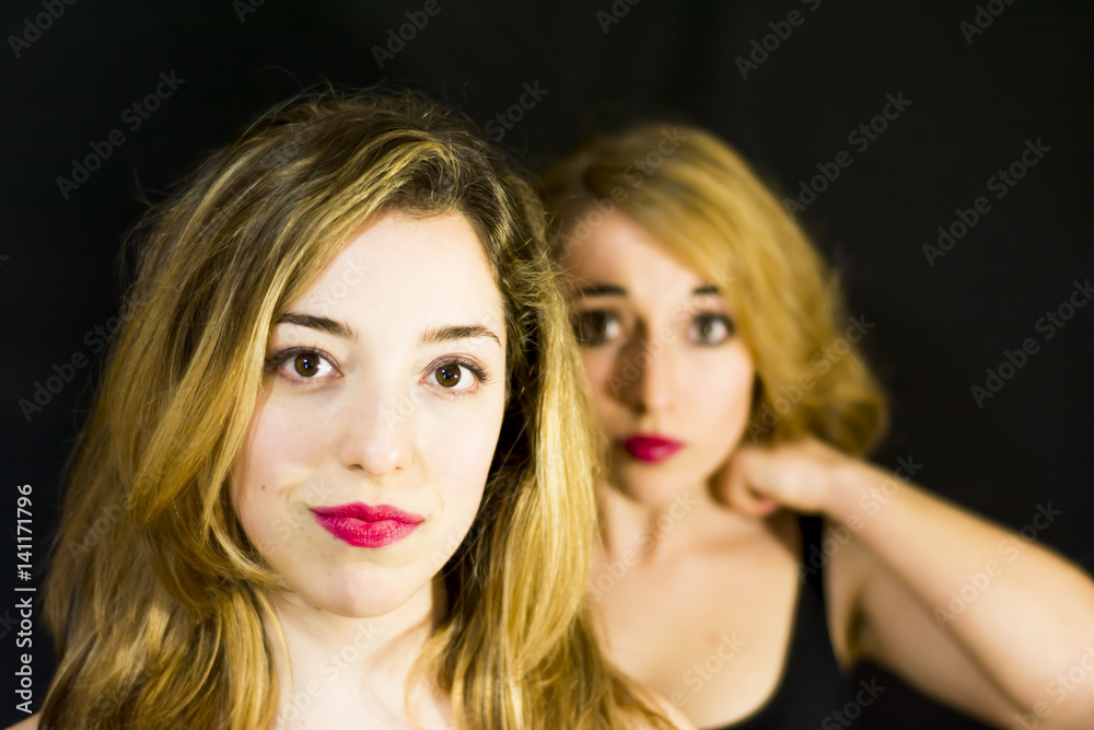 Two beautiful women Portrait over Black Background Two beautiful women Portrait over Black Background