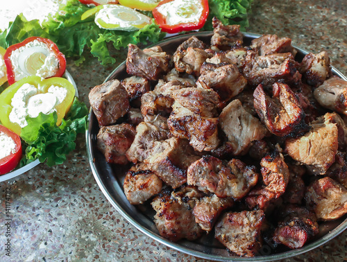 Shashlik or kebab (grilled meat) on the big plate photo