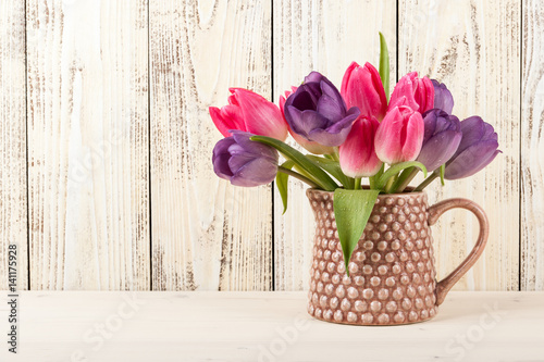 Fresh colorful tulips bouquet in jug