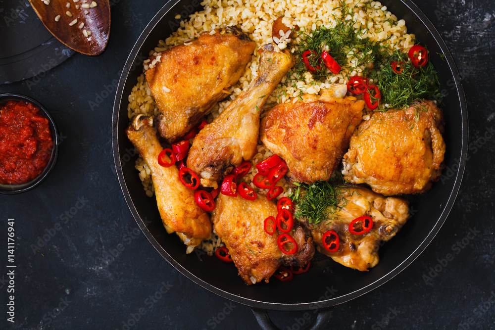 Fried chicken stew. Skillet Fried chicken with vegetable. Crispy fried chicken meat. Top view. Fried chicken stew. Skillet Fried chicken with vegetable. Crispy fried chicken meat. Top view.