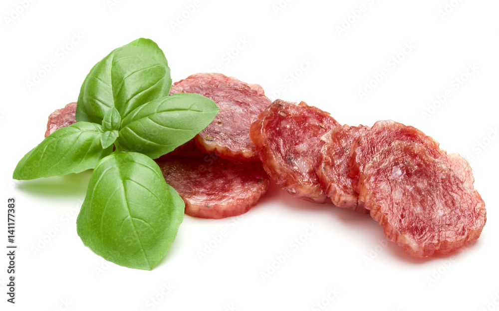 Salami smoked sausage slices and basil leaves isolated on white background cutout Salami smoked sausage slices and basil leaves isolated on white background cutout