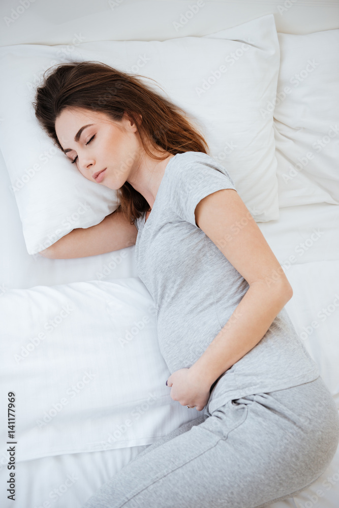 Vertical image of sleeping pregnant woman Vertical image of sleeping pregnant woman