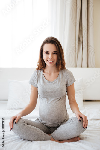 Vertical image of happy pregnant woman