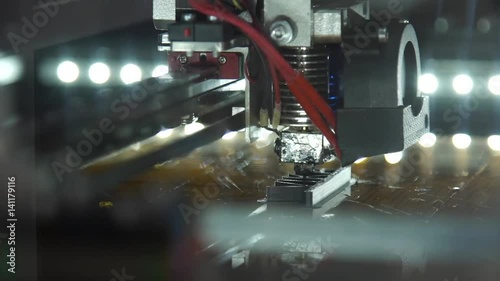 Automatic three dimensional 3d printer performs product creation. Modern 3D printing or additive manufacturing and robotic automation technology.