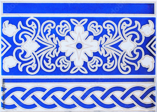 Detail of the traditional tiles from facade of old house. Spain. Valencia. Floral ornament. Majolica,