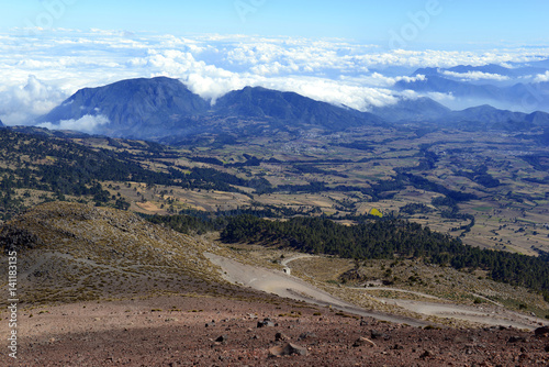 Open landscape with Mountain terrain near Pico de Orizaba volcano, or Citlaltepetl, is the highest mountain in Mexico photo