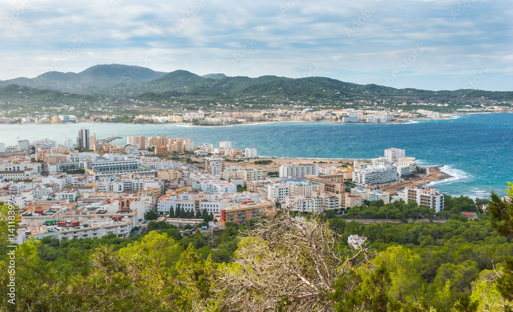 View from the hills in St Antoni de Portmany & surrounding area in Ibiza.  Clearing November day in the bay.  Islands near Spain.  Resort hotels along the beaches.