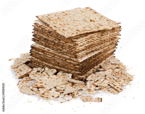 Pile of matza and some broken matza at the side - Traditional kosher bread for Passover photo