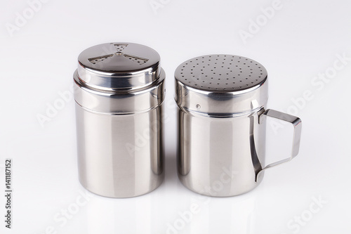 Stainless steel salt and pepper shakers isolated on white