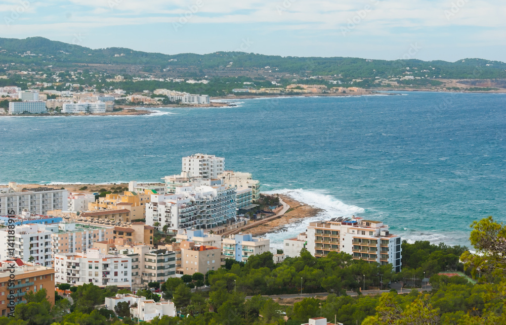 View from the hills in St Antoni de Portmany & surrounding area in Ibiza.  Clearing November day in the bay.  Islands near Spain.  Resort hotels along the beaches.
