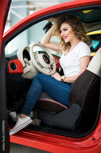 Beautiful woman at the car photo