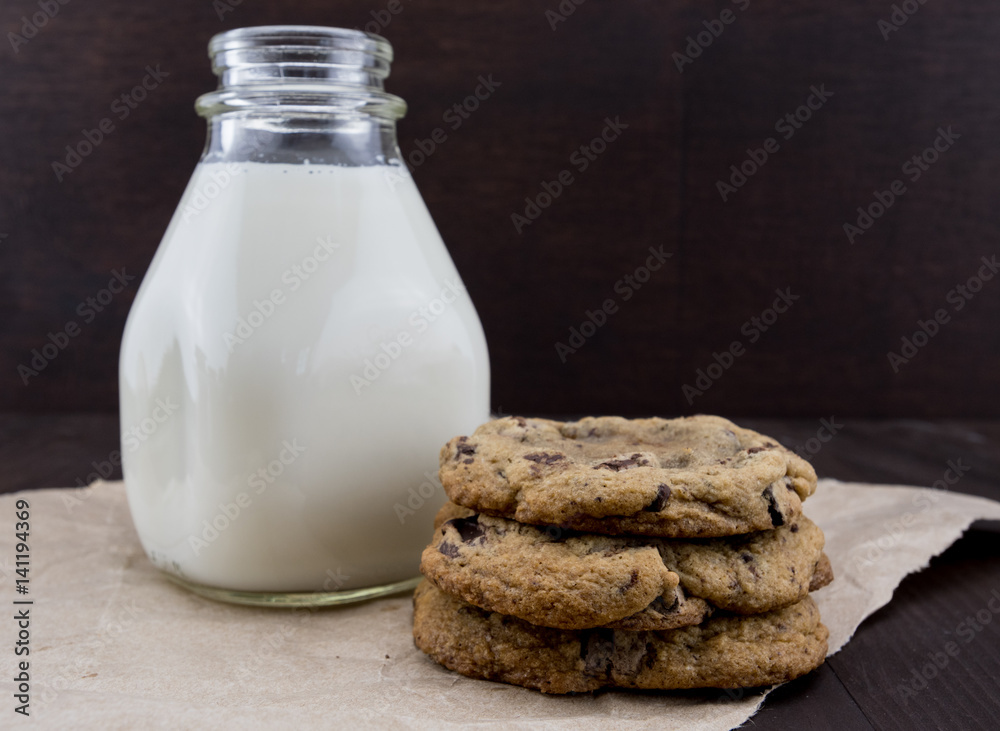 Chocolate Chip Cookies on Brown Paper with Milk Chocolate Chip Cookies on Brown Paper with Milk