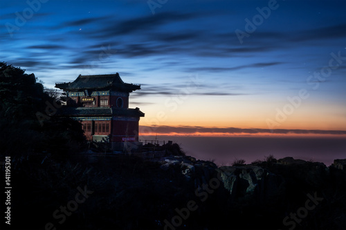 Temple and sunset on the summit of Taishan, China photo