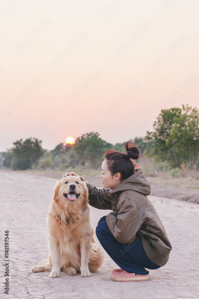 Friendship Girl playing with dog