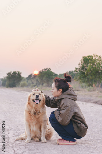 Friendship Girl playing with dog © Achira22