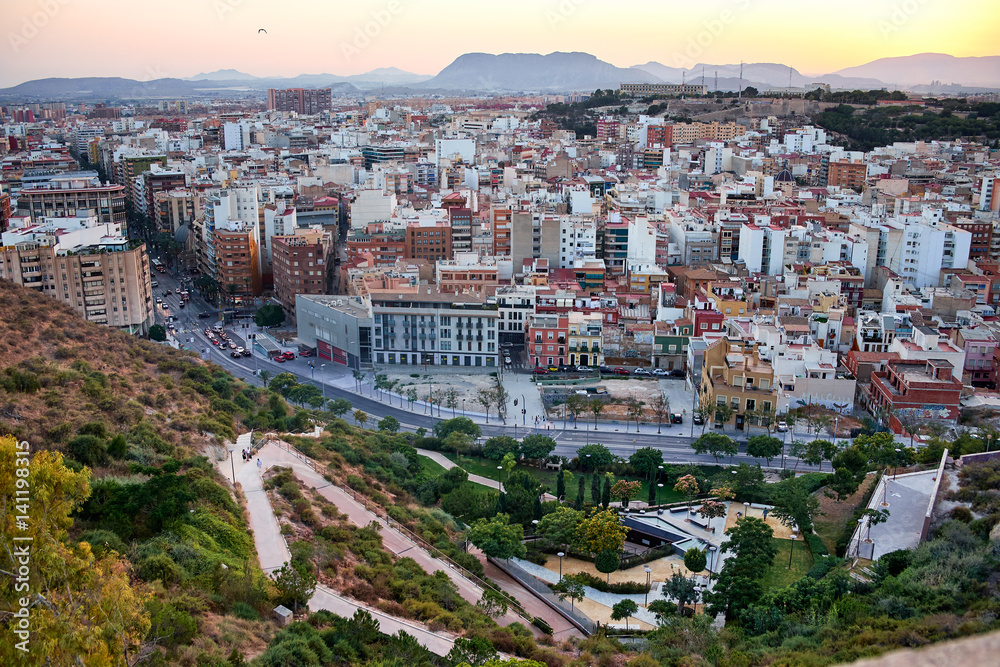 Beautiful view of the old town and Mount Benacantil from Santa Barbara Castle. Enjoying the sunset. Alicante, Spain.