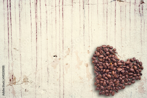 Coffee beans in form of heart on beautifull background. Love. Insparation. On concrete background.