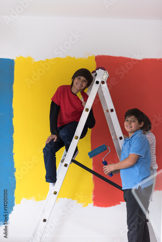 boys painting wall
