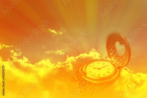 Watch or clock in dreamy sun ray light emerge or spread trought the big dark cou Fototapet