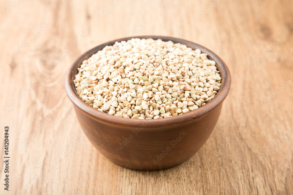 green buckwheat on wooden table. Healthy diet concept food green buckwheat on wooden table. Healthy diet concept food