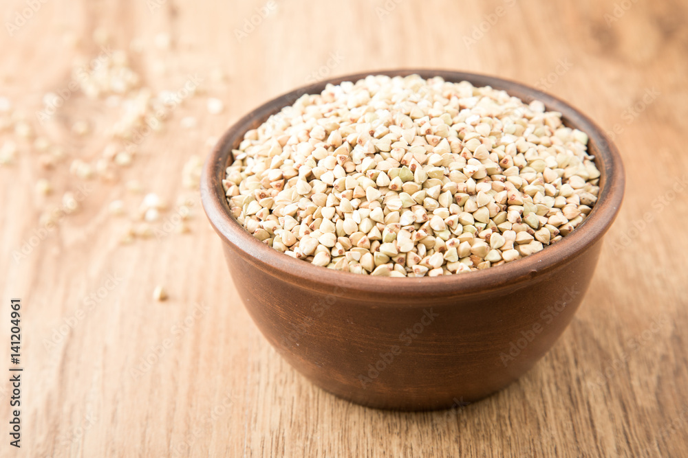green buckwheat on wooden table. Healthy diet concept food green buckwheat on wooden table. Healthy diet concept food