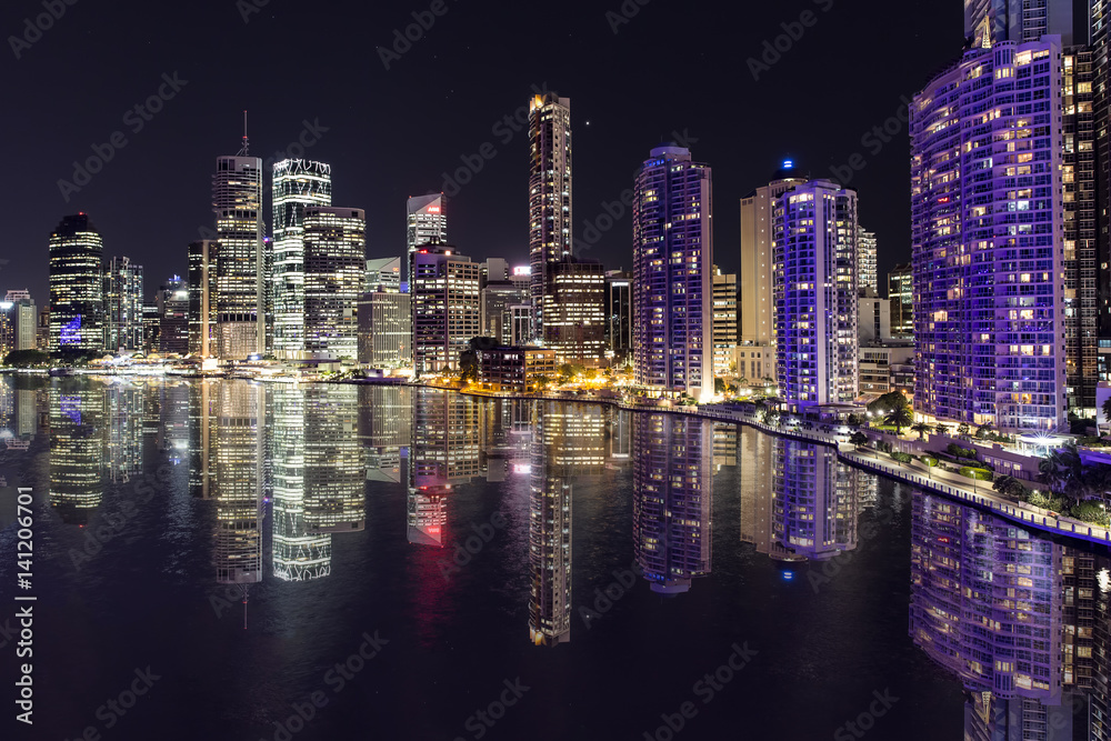 Brisbane cityscape reflections by night on the Brisbane river, viewed from the Story Bridge.