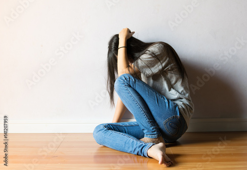 girl are afraid sitting on white background