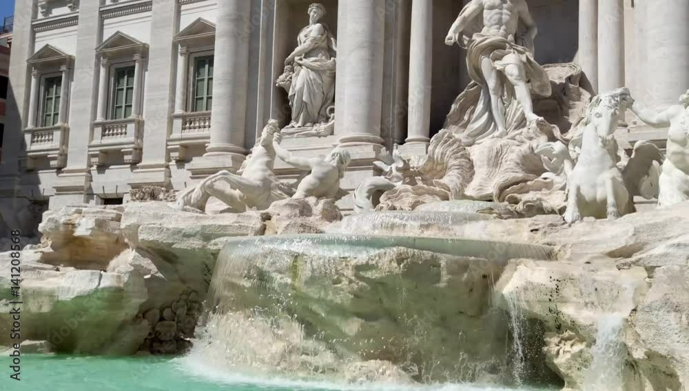 Tourists visiting the Trevi Fountain on a hot sunny day Tourists visiting the Trevi Fountain on a hot sunny day