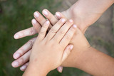 Background of hands of asian female adult and two kids group together for support