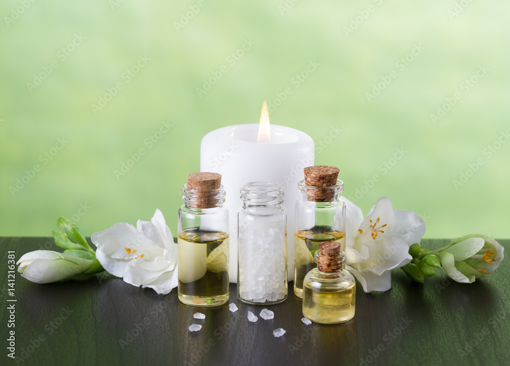 Aromatherapy essential oils, candle,flowers and sea salt