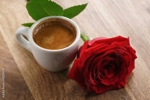 fresh espresso with red rose flower, romantic morning photo