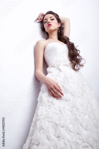 Portrait of beautiful young woman bride in white Wedding Dress