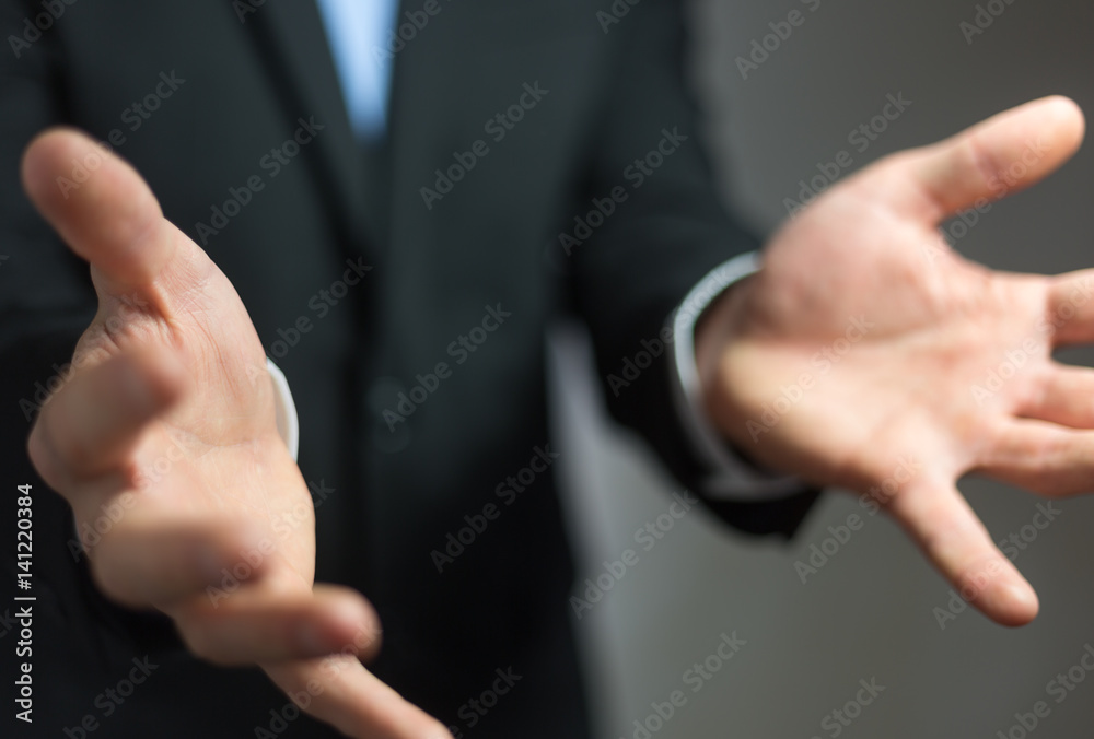 Businessman showing his empty hand