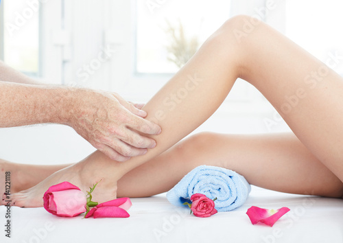 Foot massage in spa salon, closeup.