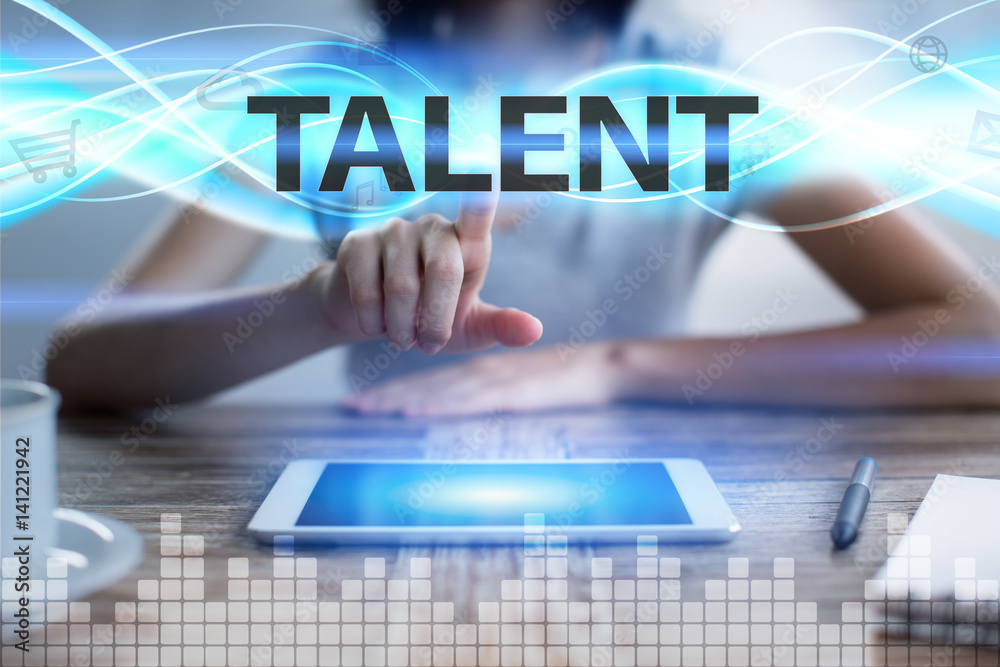 Woman using tablet pc, pressing on virtual screen and selecting talent.
