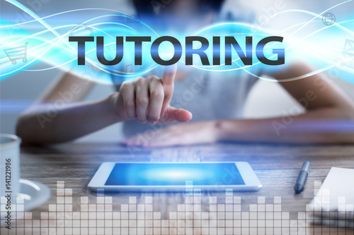 Woman using tablet pc, pressing on virtual screen and selecting tutoring.