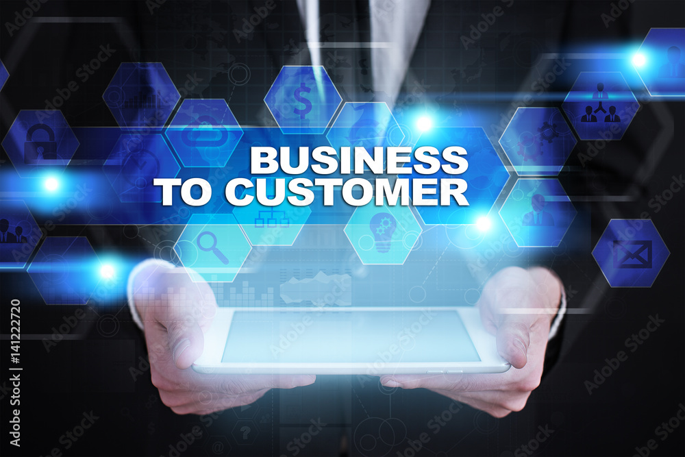 Businessman holding tablet PC with business to customer concept. Businessman holding tablet PC with business to customer concept.